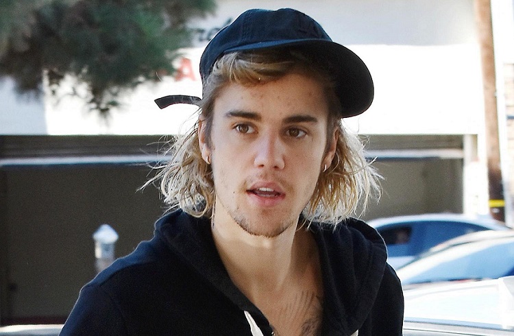 Bieber é processado por paparazzo após postar foto sem autorização